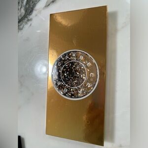 BECCA Gold and Black Highlighter Radiant Glow